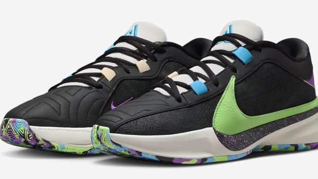 Side view of Giannis Antetokounmpo's black, green, and blue Nike shoes.